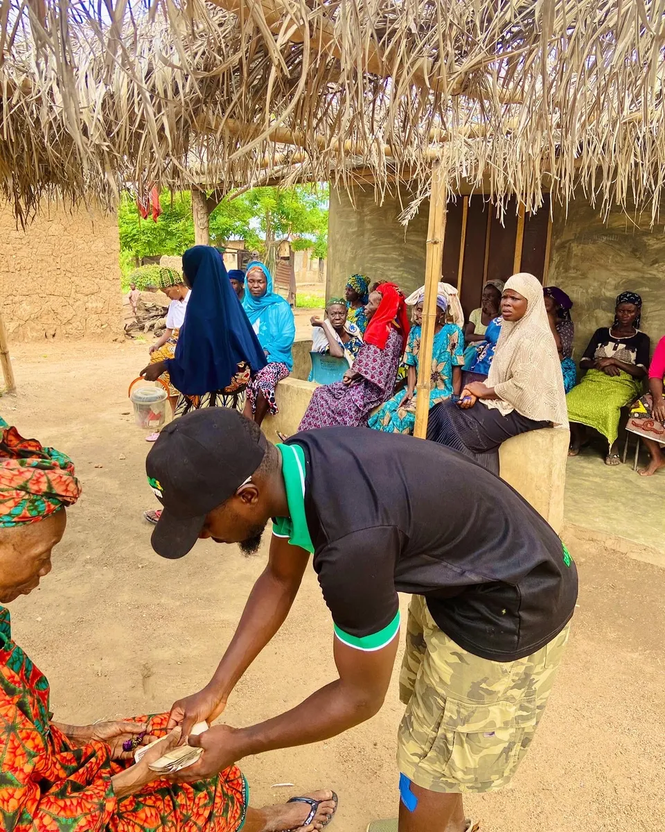 BAGSfarm seed grant being handed to a woman entrepreneur in the community
